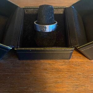 A cross to bare silver ring.